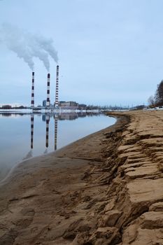 industrial smoke from chimney on blue sky