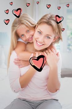 Red Hearts against mother and daughter smiling at camera