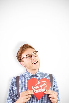 Geeky hipster holding a heart card against mothers day greeting