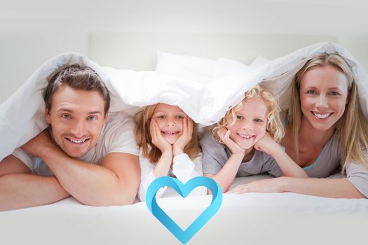 Family under the cover against blue heart