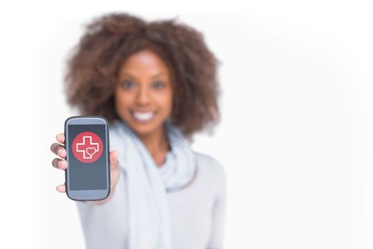 Woman with afro showing her smartphone against heart and cross