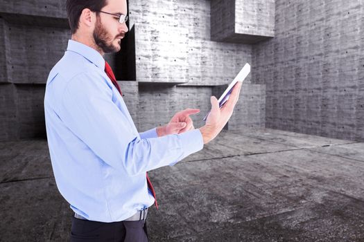 Businessman scrolling on his digital tablet against abstract room