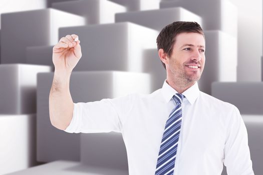 Smiling businessman writing something with white chalk against abstract white design