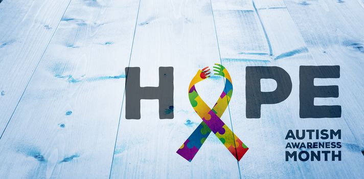 autism awareness month against bleached wooden planks background