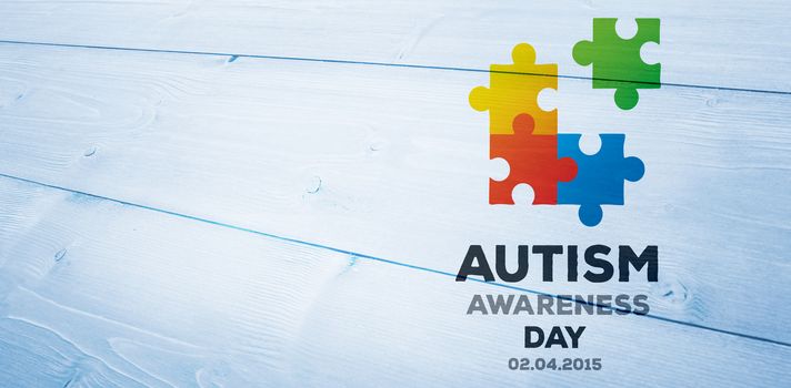 Autism awareness day against bleached wooden planks background