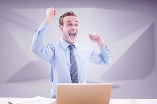 Businessman cheering against abstract grey room