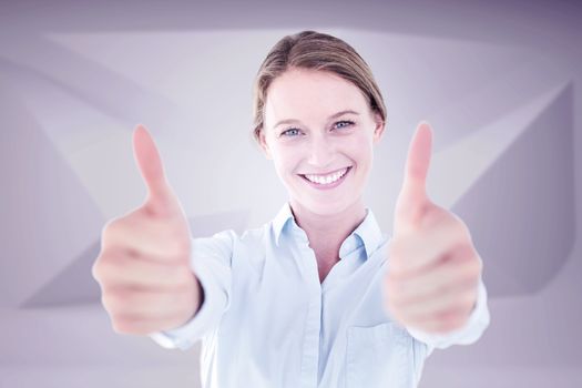 Smiling businesswoman looking at camera against abstract grey room