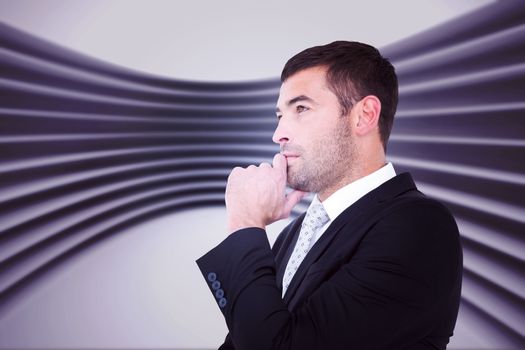 Frowning businessman thinking  against abstract room