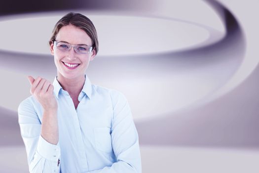 Smiling businesswoman looking at camera against white abstract room