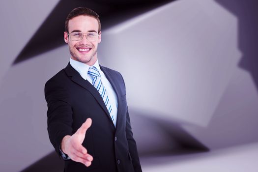 Businessman smiling and offering his hand against abstract grey room