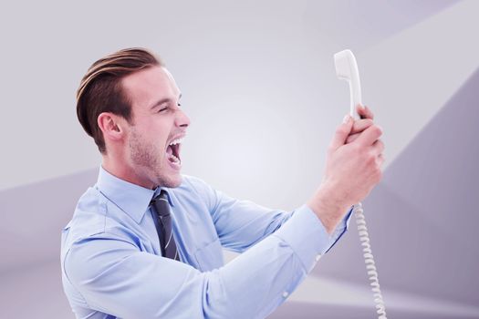 Businessman shouting at phone against abstract white room