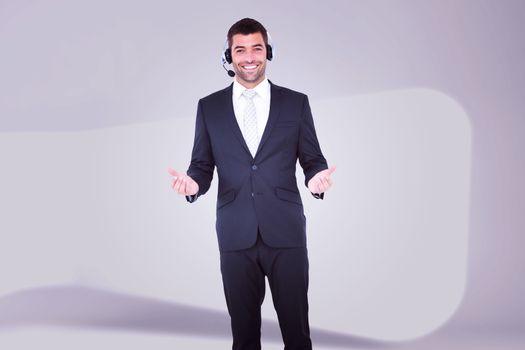 Businessman wearing headset against abstract room