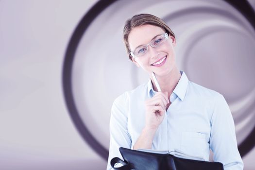 Smiling businesswoman looking at camera against abstract white room