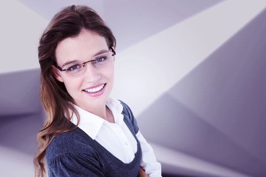 Pretty woman smiling at camera  against abstract white room