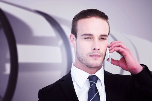 Portrait of businessman on the phone  against white abstract room