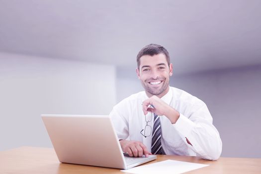 Businessman smiling against abstract room