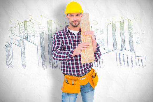 Handyman holding wood planks against crumpled white page 