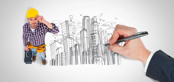 Hand writing with a pen against large city buildings together
