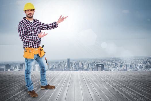 Handyman showing something against room with large window looking on city