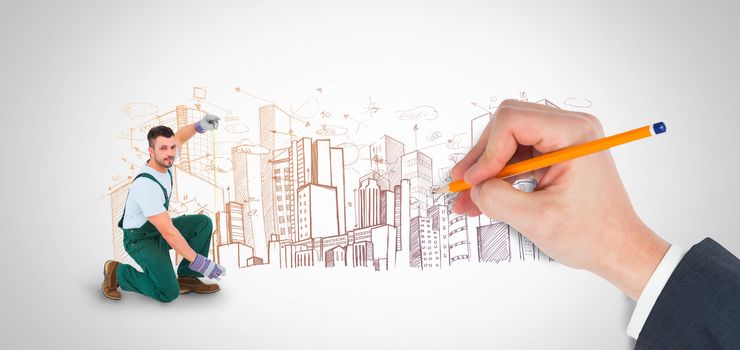Hand writing with a pencil against large city buildings together