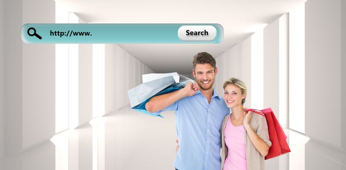 Attractive young couple holding shopping bags against digitally generated room