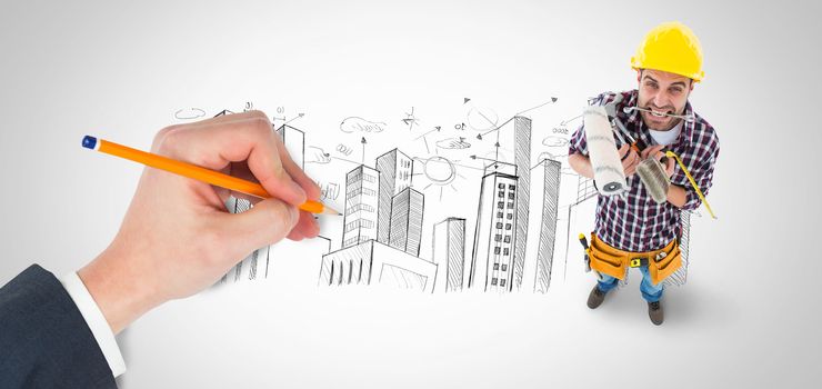Hand writing with a pencil against city plan