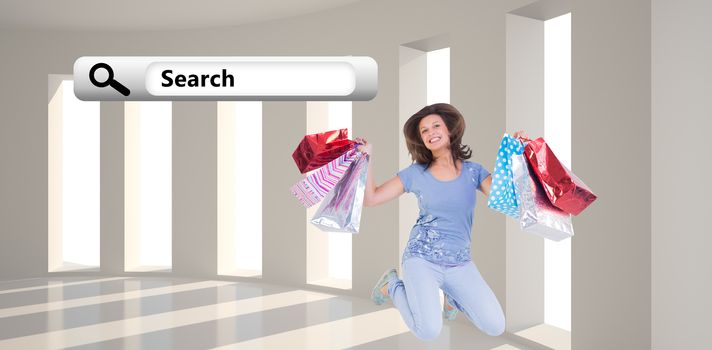 Excited brunette jumping while holding shopping bags against bright room with windows