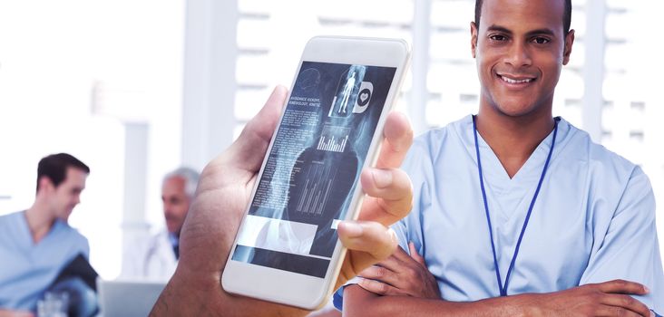 hand holding smartphone against smiling doctor with arms crossed