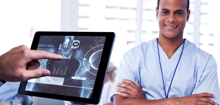 Man using tablet pc  against smiling doctor with arms crossed