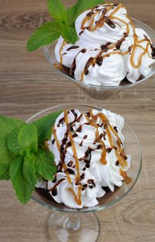 Chocolate dessert with whipped cream drizzled with topping