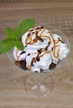 Chocolate dessert with whipped cream drizzled with topping