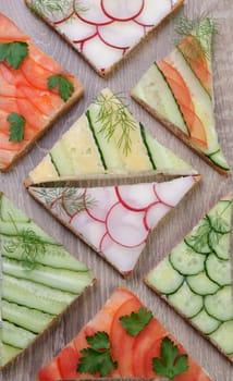 variety of vegetable sandwiches on a table 