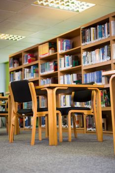 Volumes of books on bookshelf in library at the university