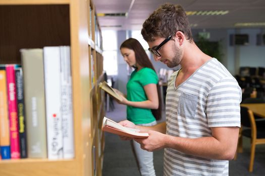 Students reading in the library at the university 