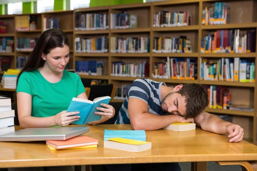 Students studying together in the library at the university 