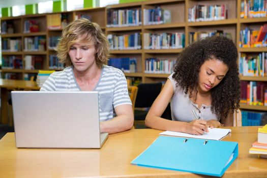 Students studying together in the library at the university 