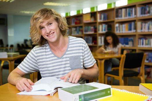 Student studying in the library at the university