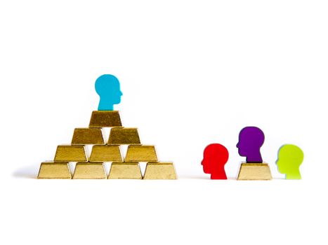 Golden bricks: wealth inequality conceptualisation isolated with tokens tokens