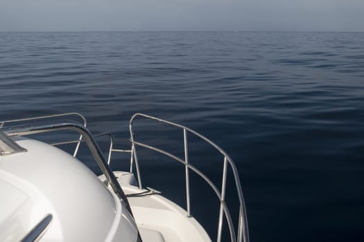 calm sea with yacht on foreground