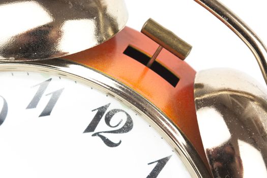 Close up of an alarm clock on a white background