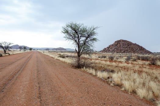 endless road in fantrastic Namibia moonscape landscape, Hardap region