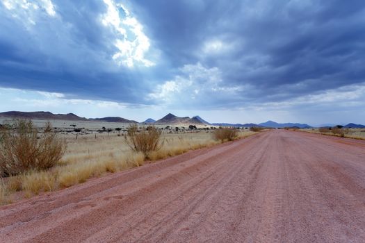 endless road in fantrastic Namibia moonscape landscape, Hardap region