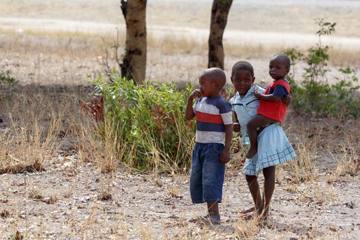 NAMIBIA, KAVANGO, OCTOBER 15: An unidentified dirty and poor Namibiann childrens near town Rundu in Kavango region, with the highest poverty level in Namibia. October 15, 2014, Namibia