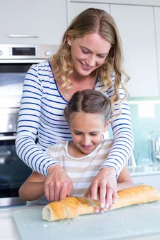 Happy family preparing lunch together at home in the kitchen