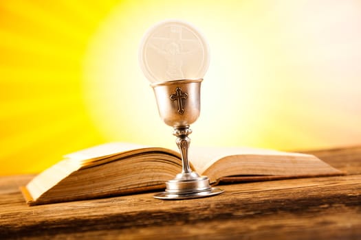 First communion, bright background, saturated concept