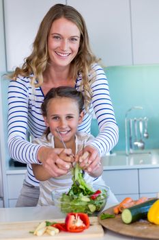 Happy family preparing lunch together at home in the kitchen