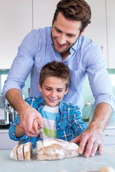 Happy family preparing lunch together at home in the kitchen