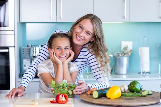 Happy family preparing lunch together at home in the kitchen