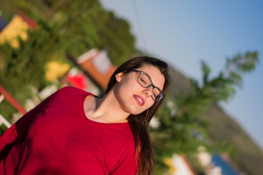 A young beautiful caucasian girl facing the sky.