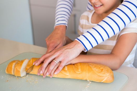 Happy family preparing lunch together at home in the kitchen